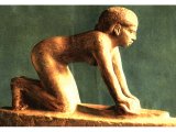 Limestone statue of a maid grinding corn. 5th Dynasty c. 2650 BC